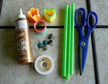 Slinky Flower supplies include magic springs, marbles, straws, and craft glue.
