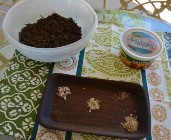 Potting soil (or compost), terra-cotta air-dry clay and seeds