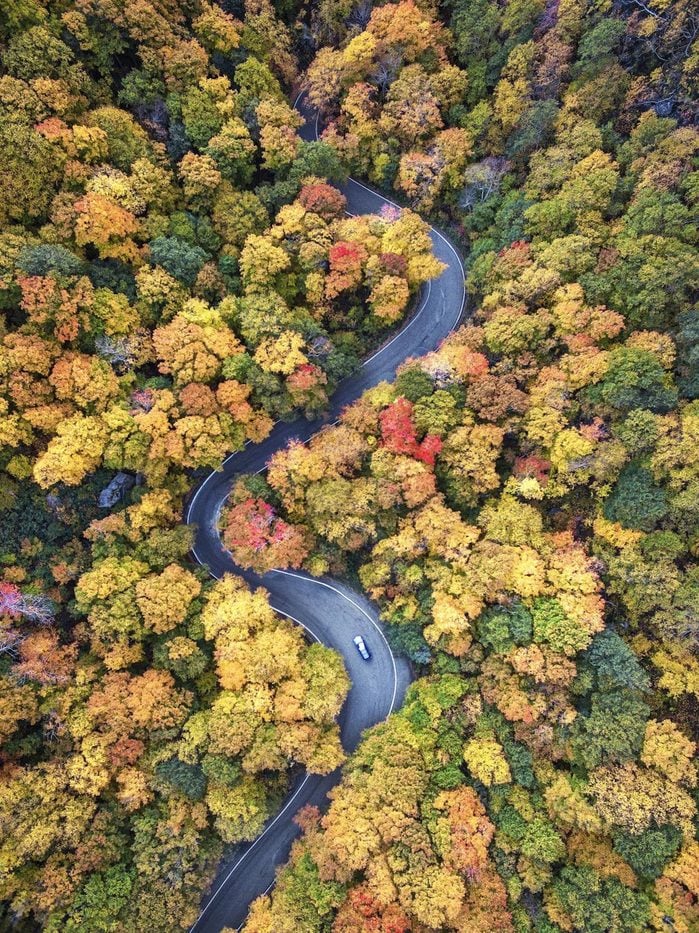 An aerial view of fall colors along route 108 in Smuggler's Notch Vermont