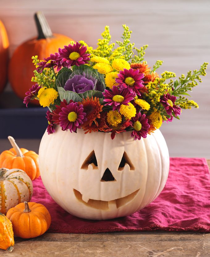 flowers in a pumpkin