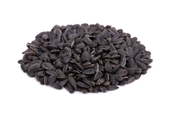 Heap of Black sunflower seeds isolated on white background