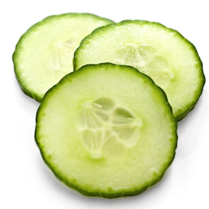 seed saving, Three Slices Of Cucumber On A White Background