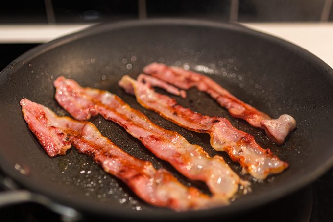 Bacon cooking in a frypan