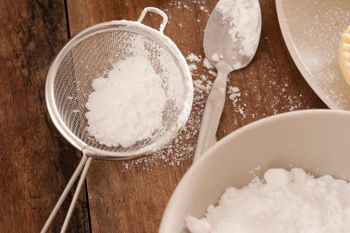 High Angle View Of Powdered Sugar On Kitchen Counter