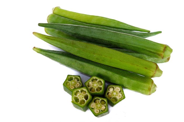 summer fruits and vegetables, Close-Up Of Okras On White Background
