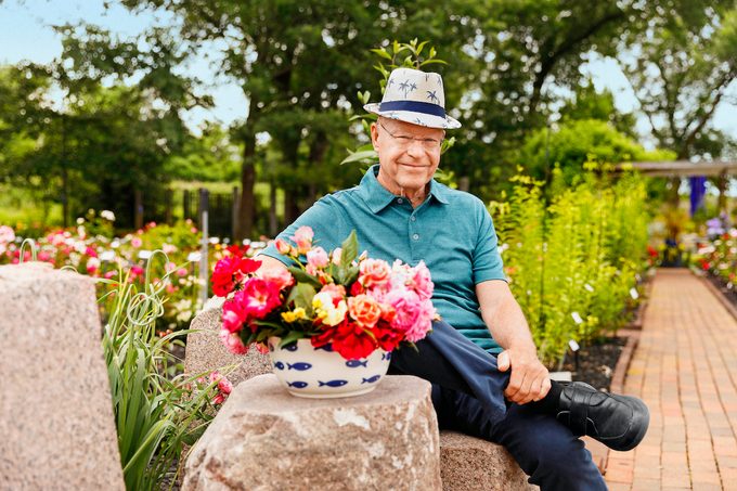 Will Radler, Inventor Of The Knockout Rose, Sits On A Bench In His Test Garden In Greenfield, Wi In July Of 2019.