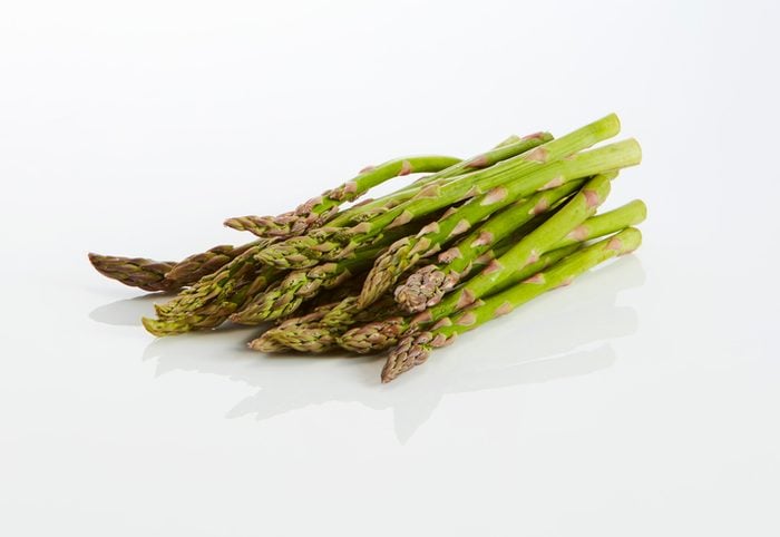 Green asparagus on white ground
