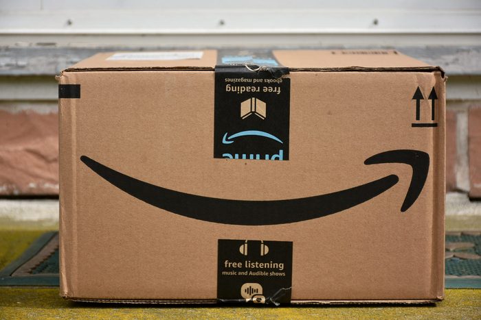close up of an amazon box on a front porch