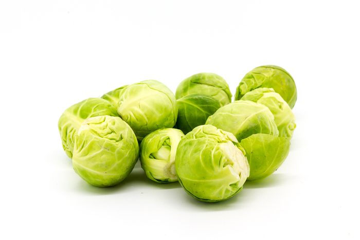 Close-Up Of Brussels Sprouts Against White Background