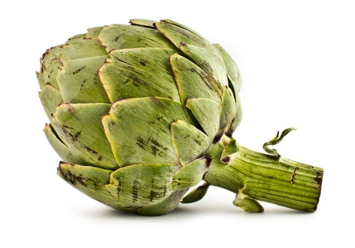 Close-Up Of Artichoke Against White Background