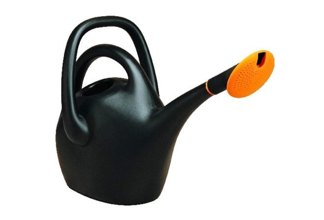 A black watering can with a long neck and two handles to make it more manageable.